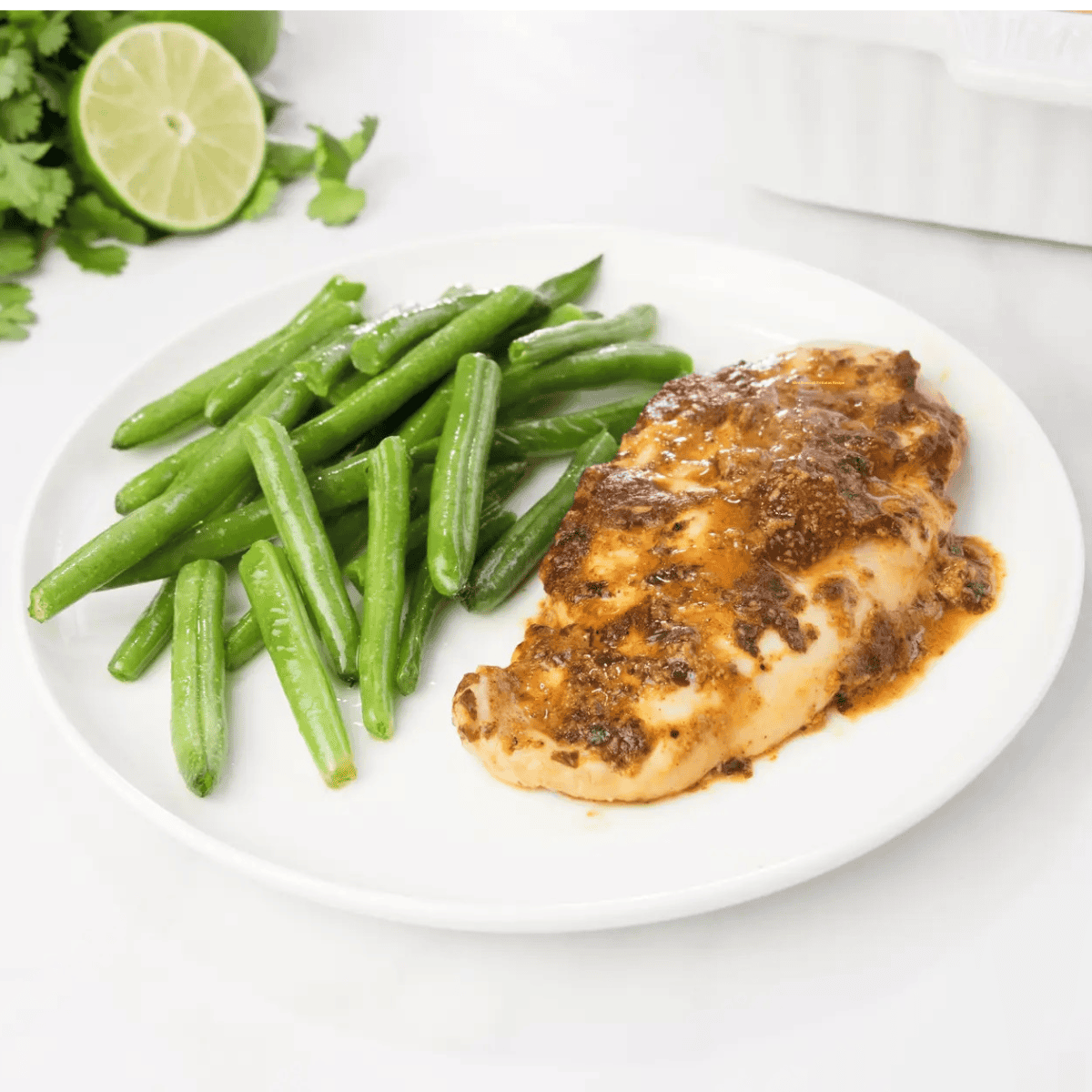 Baked Mustard Lime Chicken on a white plate.